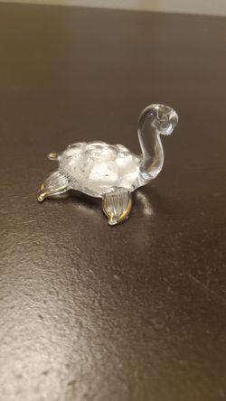 Miniature decorative turtle figurine.