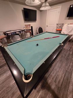 Vintage pool table with return pockets