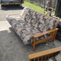 Futon And two Comforter's 