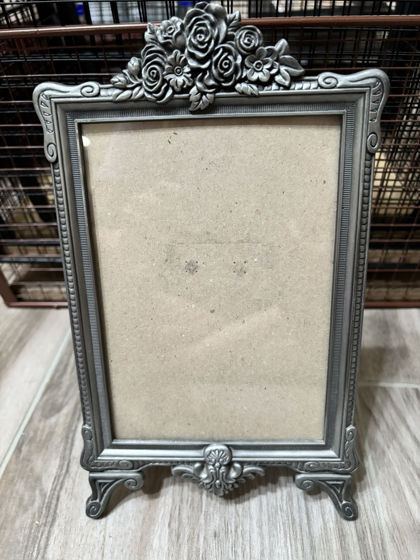 Metal frame with floral accent