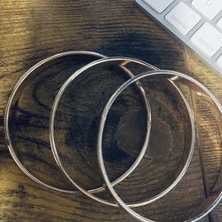 Three Gold Bangle Bracelets 
