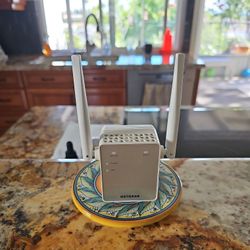 Netgear Ex6120 AC1200 WiFi Range extender dual band wall plug booster.