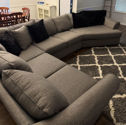 Large gray curved sectional