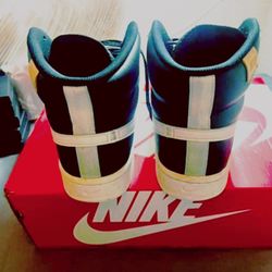 Nike black and white leather high top trainers