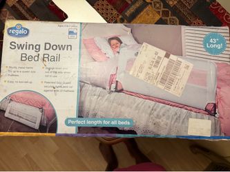 Swing down bed rail