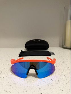 Orange Oakley Hydra Sunglasses with Prizm Blue lenses