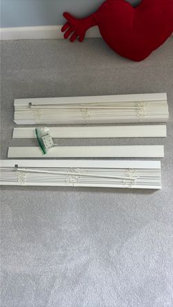 Two sets of faux plantation blinds