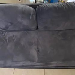Small Couch With A Blue Cover