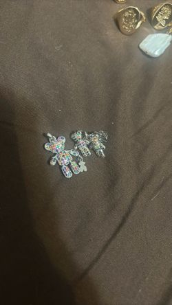 Charm necklace with a pair of earrings