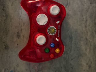 Wired controller with a translucent red shell. Responsive thumbsticks and D-pad for precise input. Multicolored action buttons for easy recognition. E