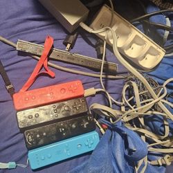 Wii Game Console And Four Remotes