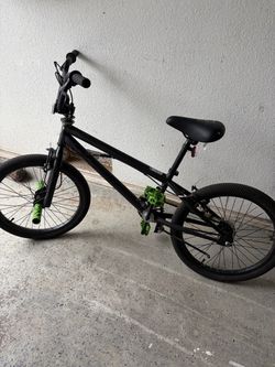 Black BMX Bike with Green Pedals