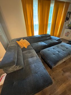 Modern Blue Modular Sectional Sofa with Ottoman with drapes, and pillows