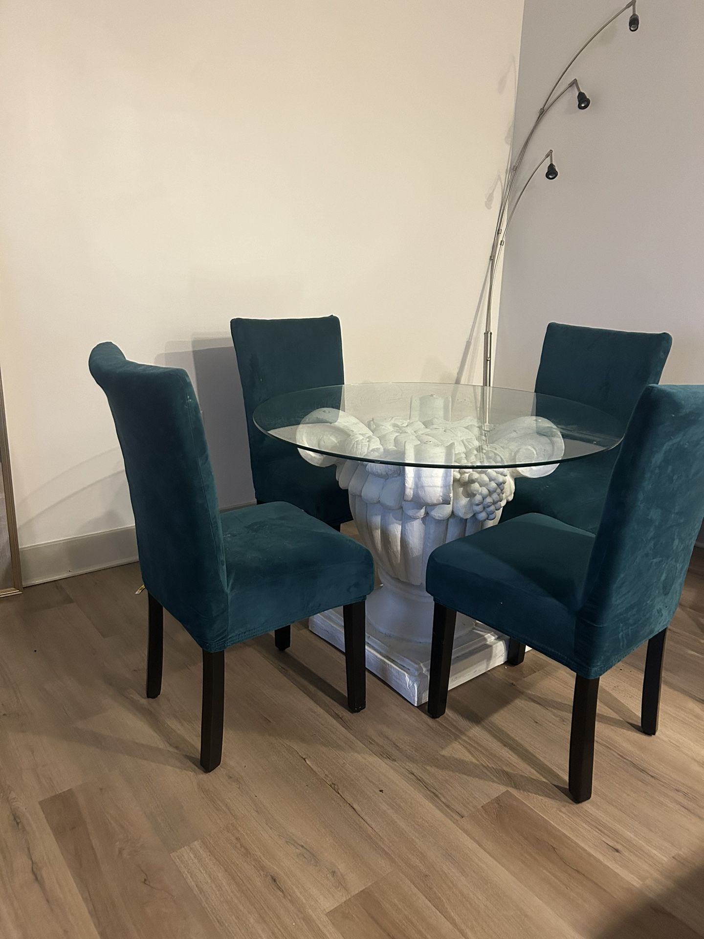 4 chair dining room set with stone base glass top table