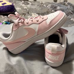 Pink Nike (woman’s size 7.5 or kids 6Y)