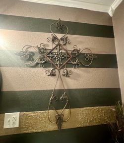 Metal cross and three saint metal wall decor