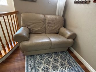 Off white leather couch and loveseat.