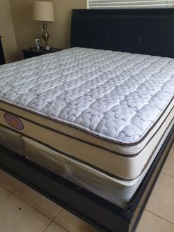 New king mattress and box springs bed frame is not included