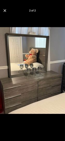 Wardrobe with mirror and bed frame with mattress