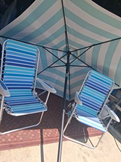 Beach chairs and  umbrella