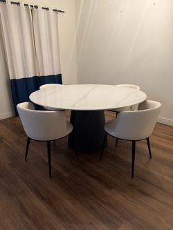 47” ROUND TABLE W/ CHAIRS $1500
