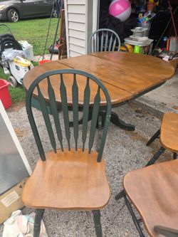 Table with leaf and 4 chairs