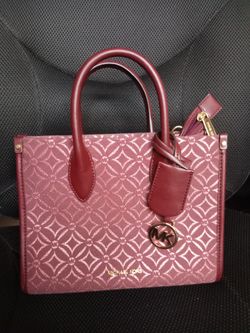 Micheal Kors smaller  purse 10 inches high and 91/2 inches  long