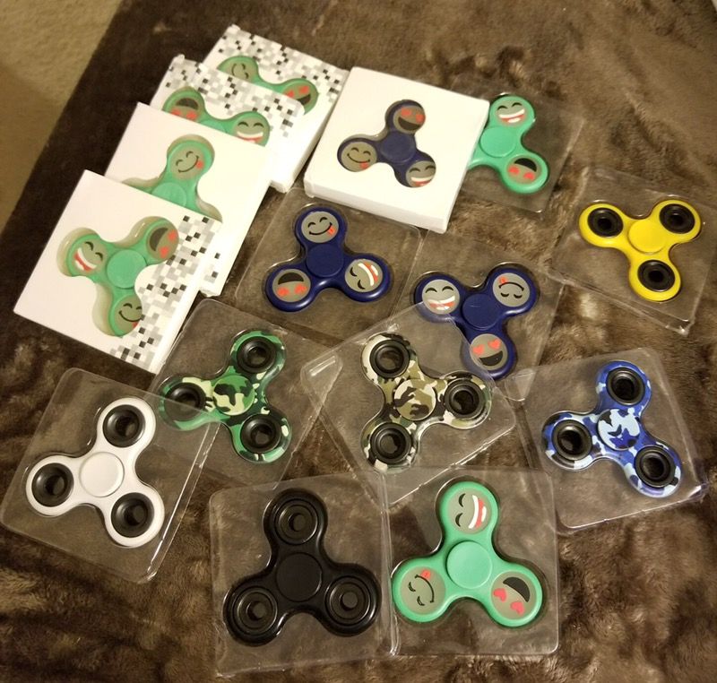 Fidget spinners emoji faces and metal