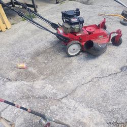 $350.00  A Running Snapper 26 ins walk behind mower