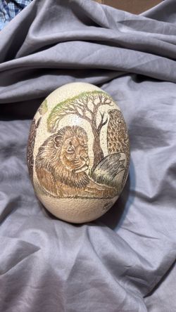 Ostrich egg carved with a big five in Africa