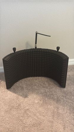 Isolation shield for microphone