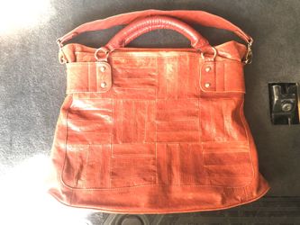 BEBE RED LEATHER HAND BAG