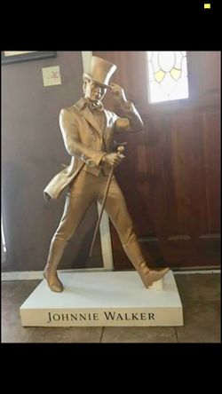JOHNNY WALKER GOLD STATUE