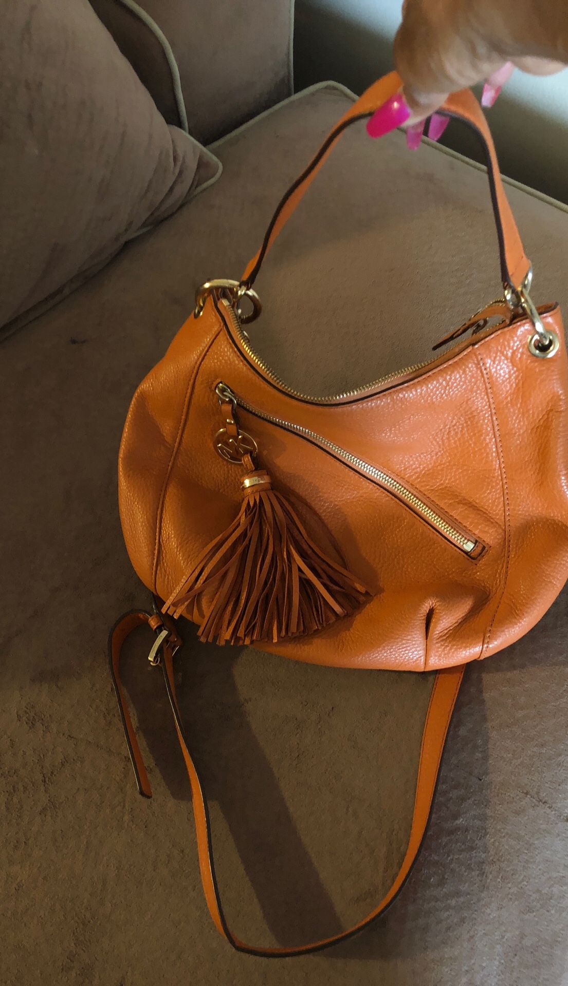 How orange Leather Michael Kors bag Excellent condition