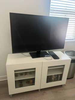 LG Flat Screen TV with White TV Stand