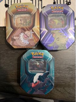 Pokemon  Mighty Mysterious Tin/Knockout Tin