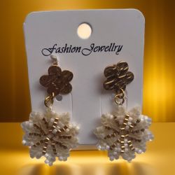 A pair of flower-shaped earrings made with colorful beads