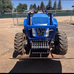 New Holland Tractor With Shredder