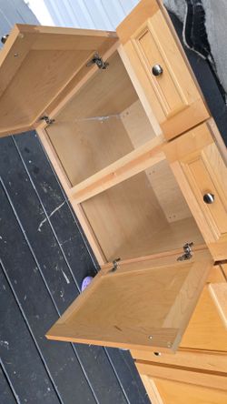 three kitchen cabinets