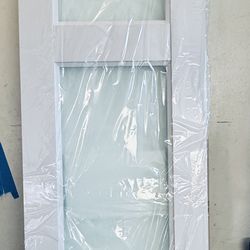 White barn door with frosted glass.