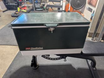 Vintage Coleman 54-Quart Steel-Belted Cooler in green and white.