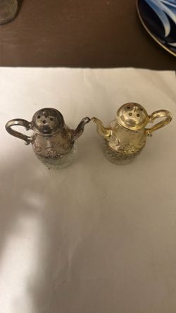 Crystal silver, and gold salt, shaker, and pepper shaker