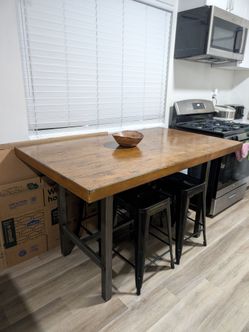 Industrial style bar height dining table