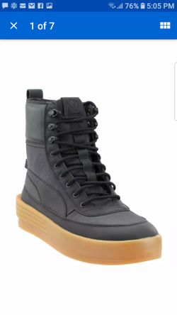 New size 12 mens Puma boots