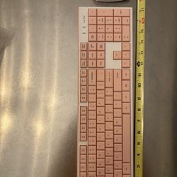 pink wireless keyboard, mouse, laptop stand