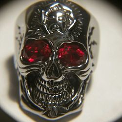 Shtainless steel red zirconia skull ring.
