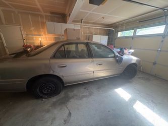 Tan  1999 Buic Century