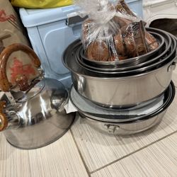 A Set Of Brand New Cooking Pots And Tea Kettle 