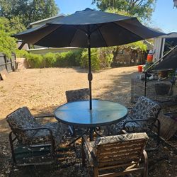 Patio Tables, Chairs (4) and Umbrella $150 OBO