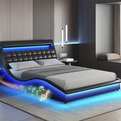 Fameill Queen Size LED Bed Frame with Bluetooth Speaker, PU Leather Upholstered Platform Bed Frame with Charging Station, Modern Wave-Like Curve, Low